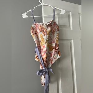 Fun tropical one piece swimsuit! Size large. Never worn.